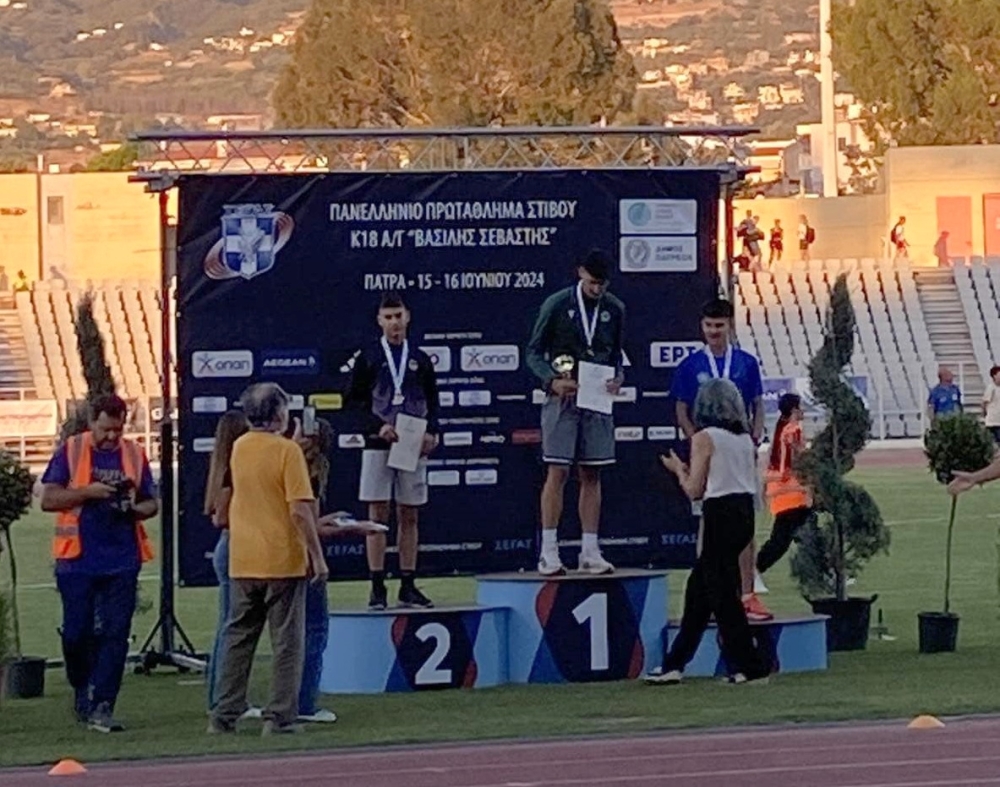 &Sigma;&tau;&omicron; &Pi;&alpha;&nu;&epsilon;&lambda;&lambda;ή&nu;&iota;&omicron; &Pi;&rho;&omega;&tau;ά&theta;&lambda;&eta;&mu;&alpha; &Sigma;&tau;ί&beta;&omicron;&upsilon; &Kappa;18 &sigma;&upsilon;&mu;&mu;&epsilon;&tau;&epsilon;ί&chi;&alpha;&nu; 7 &alpha;&theta;&lambda;&eta;&tau;έ&sigmaf; &tau;&omicron;&upsilon; &Gamma;&Alpha;&Sigma; &Epsilon;&upsilon;&rho;ώ&tau;&alpha;