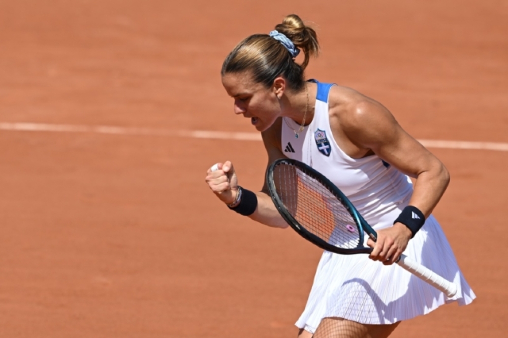 &Mu;&alpha;&rho;ί&alpha; &Sigma;ά&kappa;&kappa;&alpha;&rho;&eta;: &Sigma;&tau;&omicron;&upsilon;&sigmaf; &laquo;16&raquo; &tau;&omega;&nu; &Omicron;&lambda;&upsilon;&mu;&pi;&iota;&alpha;&kappa;ώ&nu; &Alpha;&gamma;ώ&nu;&omega;&nu; &mu;&epsilon;&tau;ά &alpha;&pi;ό &delta;ύ&omicron; ά&nu;&epsilon;&tau;&epsilon;&sigmaf; &nu;ί&kappa;&epsilon;&sigmaf;