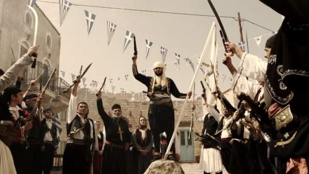 &laquo;&Tau;&omicron;&pi;ό&sigma;&eta;&mu;&alpha; &tau;&omicron;&upsilon; 1821&raquo; &mu;έ&sigma;&alpha; &alpha;&pi;ό &tau;&omicron;&nu; &alpha;&gamma;ώ&nu;&alpha; &tau;&omega;&nu; &Mu;&alpha;&nu;&iota;&alpha;&tau;ώ&nu; (&Phi;&Omega;&Tau;&Omicron;)